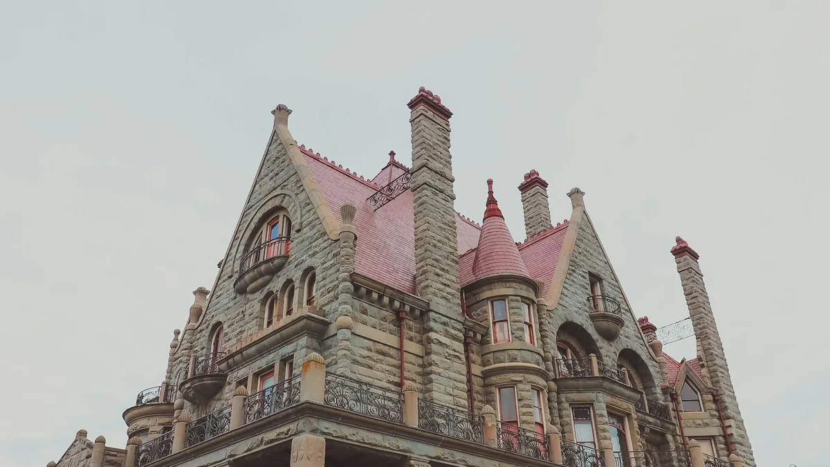 Craigdarroch Castle, a grand Victorian-era stone castle with towers and turrets in Victoria, BC
